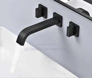 matte black, wall-mounted bathroom faucet featuring a modern square design with a dual lever handles for hot and cold water control