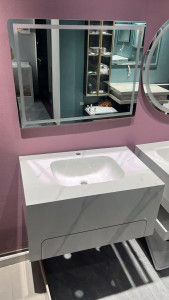 Modern wall-hung bathroom vanity set with a marble-style countertop and an illuminated led mirror