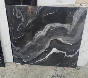 Polished porcelian floor tile featuring a black arble design with a white and gold veins