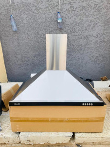 a wall-mounted Kitchen appliance desinged for removing smoke and odors