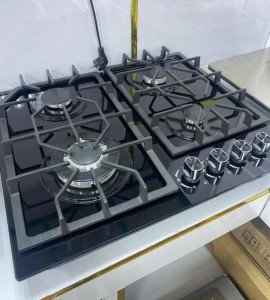 Modern built-in 4-burner gas hob cooker featuring a durable tempered glass panel and heavy-duty pan supports