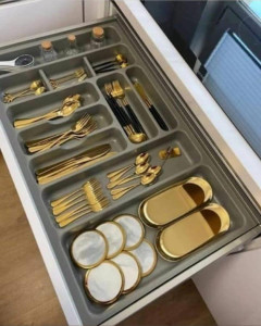 Modern Cutlery organizer with gold-plated utensils and matching dishes