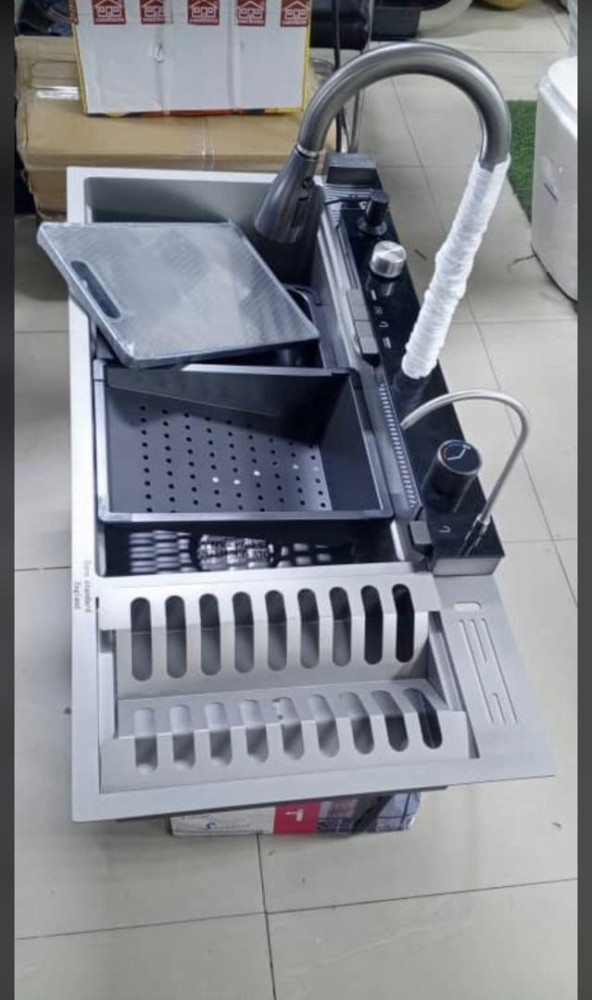 Multifuntion Kitchen sink constructed from highqaulity 304 stainless steel featuring an integrated waterfall faucet and a modern black finish