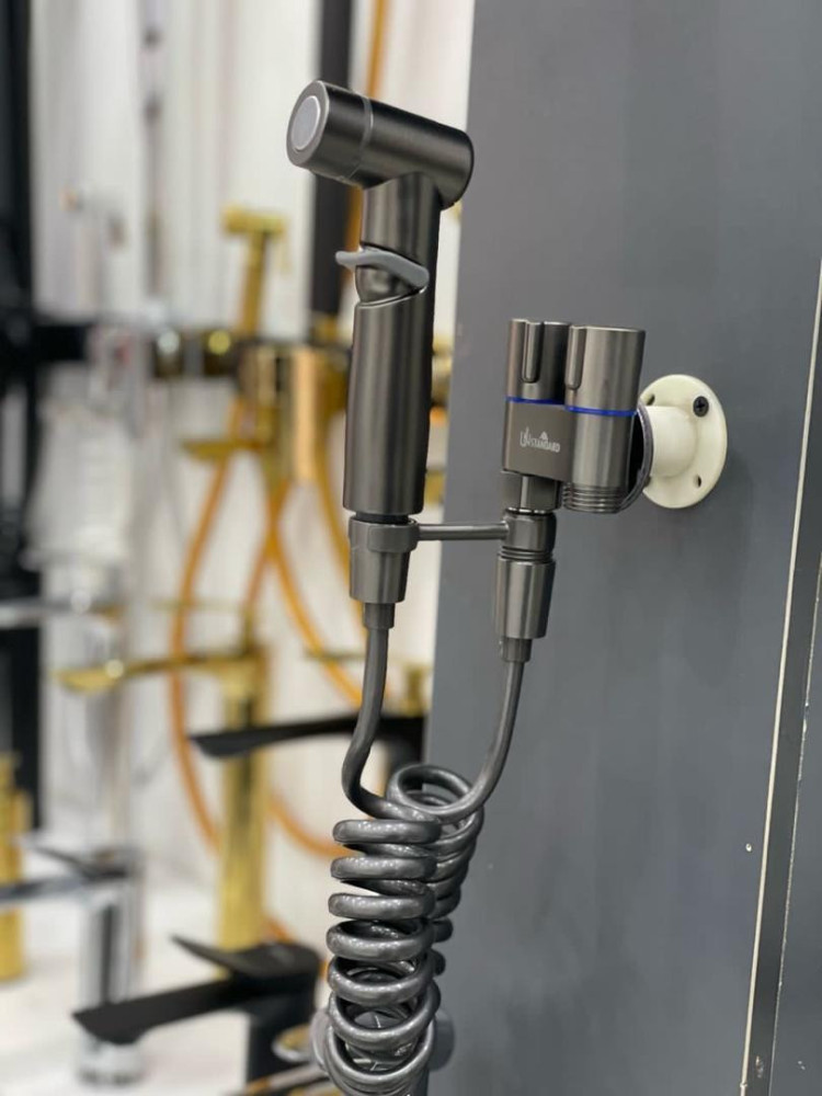 This product is a matte black handheld bidet sprayer set with a dual control valve