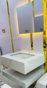 white cabinet with a marble basin and an Led mirror