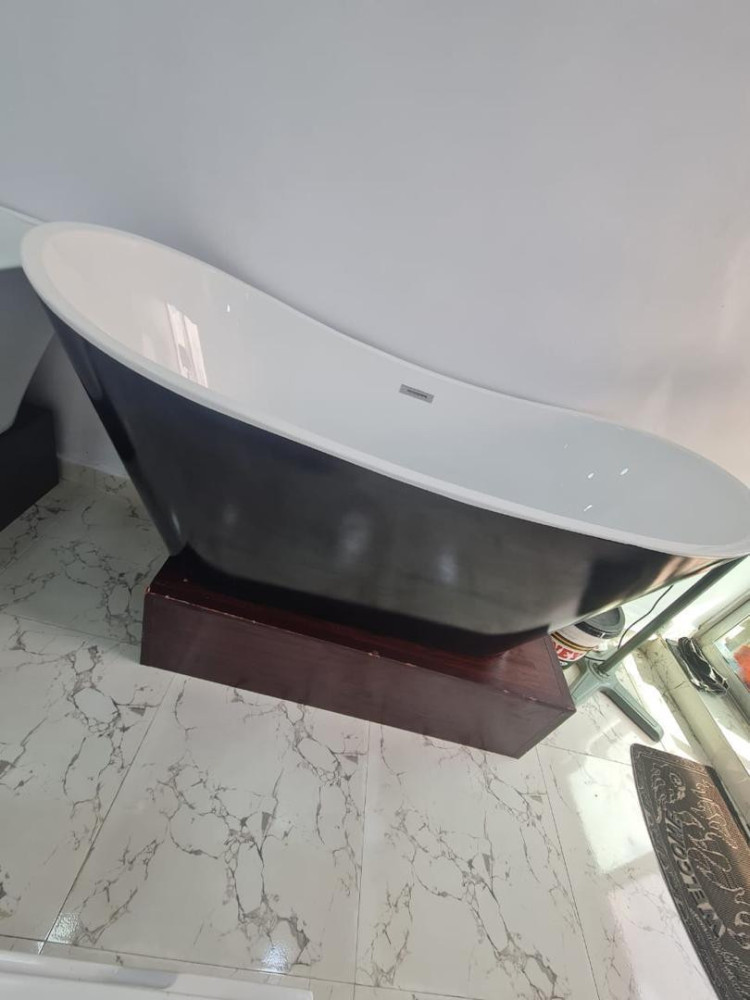 acrylic freestanding bathtub often featured in modern bathroom designs for its soaking comfort and durable construction