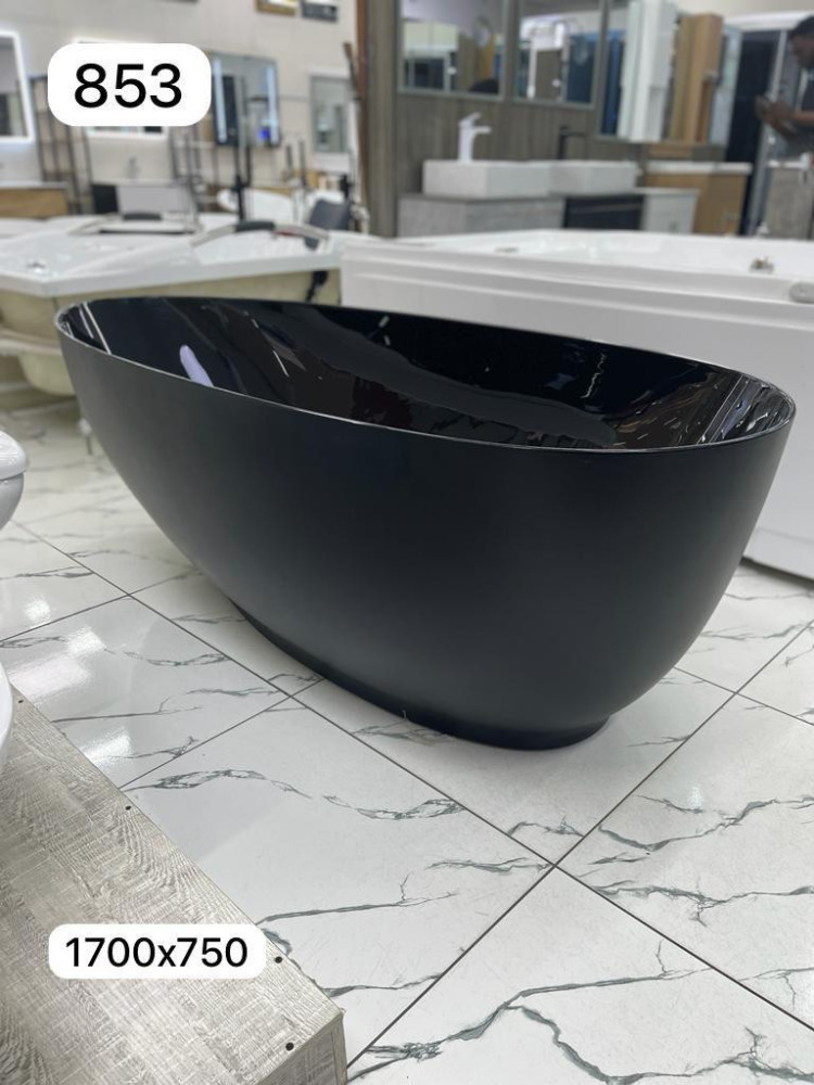 Black freestanding bathtub appears to e similar to models 