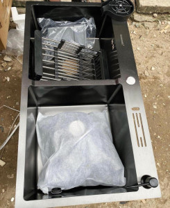 stainless steel double Kitchen sink with a black finish and accessories