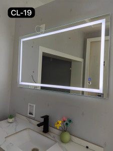 illuminated bathroom vanity mirror featuring a rectangular design with a built-in light frame and touch-sensitive controls