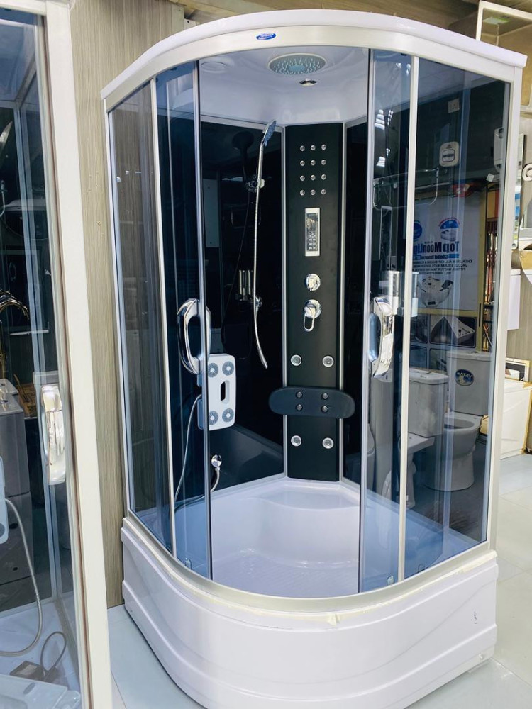 luxury corner shower cabin features integrated massage jets, a radio, and built-in lighting for a spa-like experience