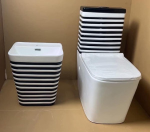 bella White and black stripped toilet set featuring a matching wall-hung basin