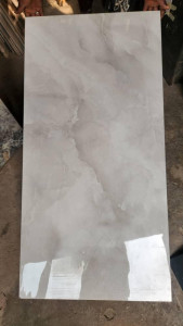 Stylish grey Polished porcelain tile wih a natural onyx stone look