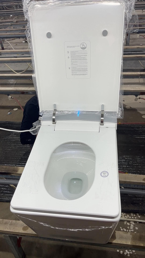 Smart toilet featuring automatic lid opening, closing, and flushing capabilities