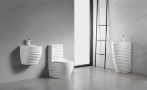 modern white ceramic bathroom set with a ribbed design and marble effect