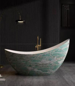 decorative freestanding bathtub featuring a curved, boat-like shape and a green marble-patterned finish