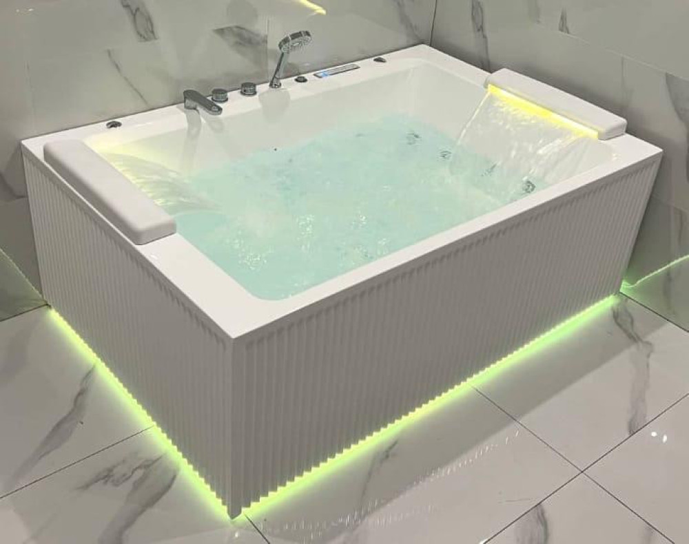 Modern Depot Premium double massage bathtub, featuring a fluted design, LED lighting, and a waterfall pillow