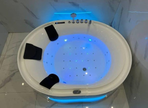 modern acrylic whirlpool massage bathtub designed to accommodate two people