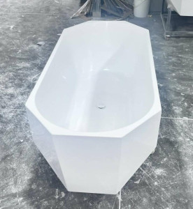 freestanding acrylic bathtub, often featuring a modern diamond-cut design