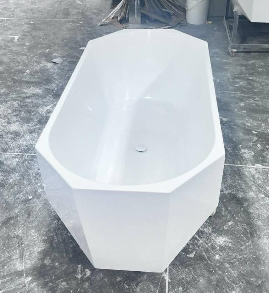 freestanding acrylic bathtub, often featuring a modern diamond-cut design